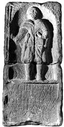The tombstone of Caecilius Avitus, optio in the XXth legion based at Chester. In his left hand he carries a case of stylus tablets,in his right is a staff.